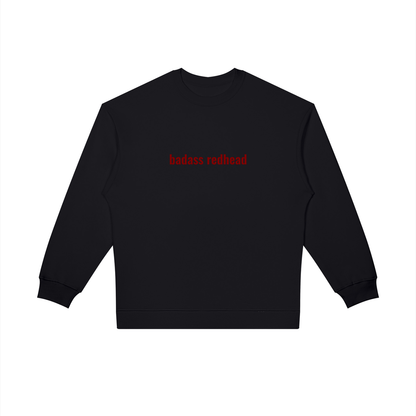 Model pairing the oversized Badass Redhead sweatshirt with casual bottoms