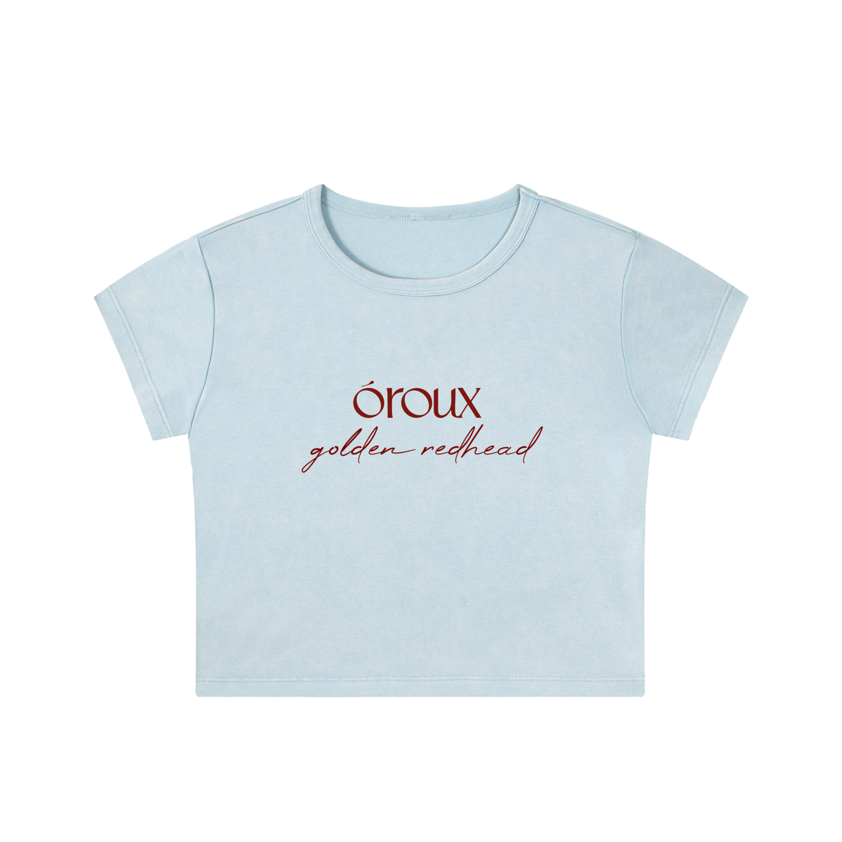 A light blue short-sleeve crop top t-shirt with 'oroux golden redhead' printed in red on the chest, shown against a plain white background.