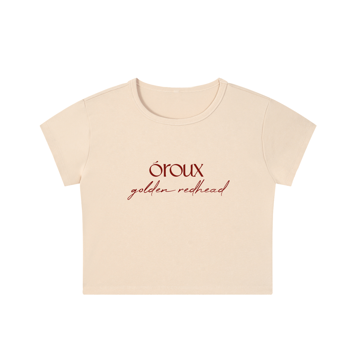 A cream-colored short-sleeve crop top t-shirt with 'oroux golden redhead' printed in red on the chest, displayed on a clean white background.