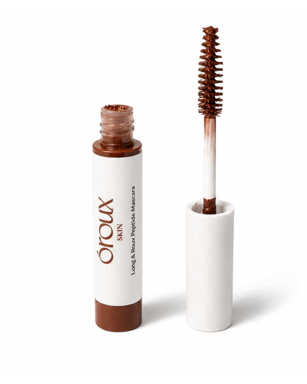 A bottle of Oroux Skin Long & Roux Peptide Mascara for redheads with its applicator wand shown beside it on a clean white background.