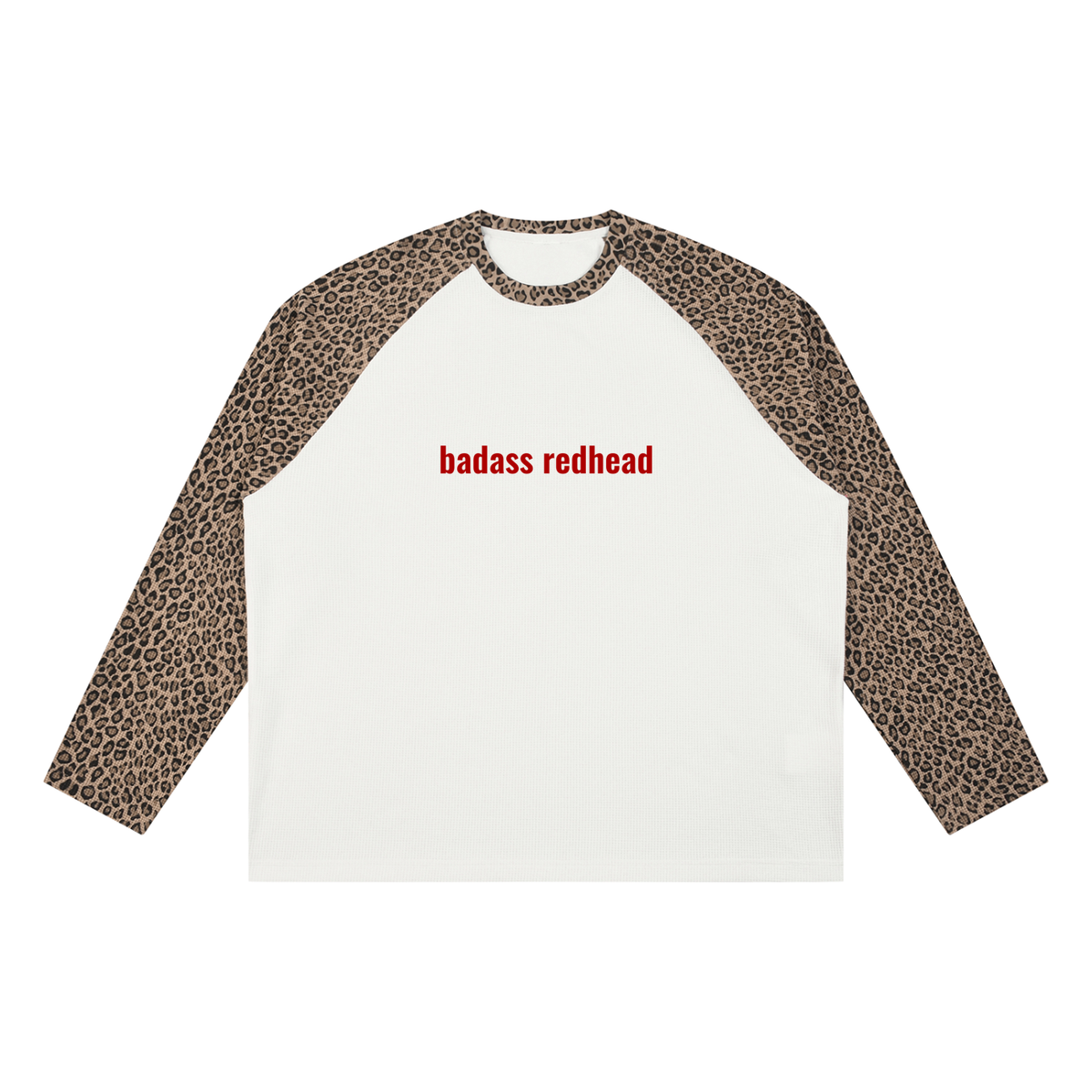 A long-sleeve raglan t-shirt with a white body, leopard print sleeves, and 'badass redhead' printed in red across the chest, shown on a plain white background.