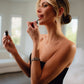 Woman applying Lush Lip oil by Bella Vida Santa Barbara