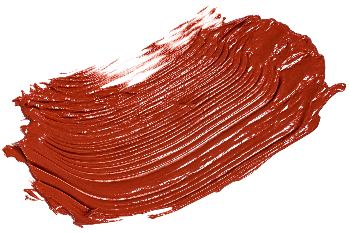 A thick, glossy swipe of warm terracotta or rust-colored cream product, showing a textured, creamy consistency, isolated on a white background.