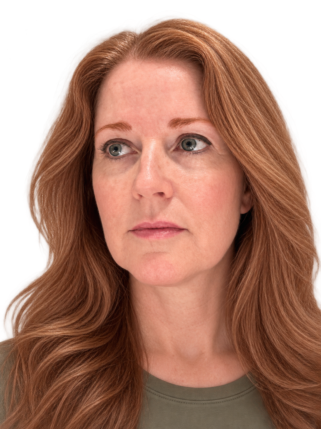 A close-up portrait of a woman with long, wavy redhead auburn hair, wearing a muted olive green top against a plain white background. She is wearing the strawberry blonde roux eyebrow gel by oroux skin.