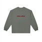 Close-up of embroidered 'Badass Redhead' text on crewneck sweatshirt