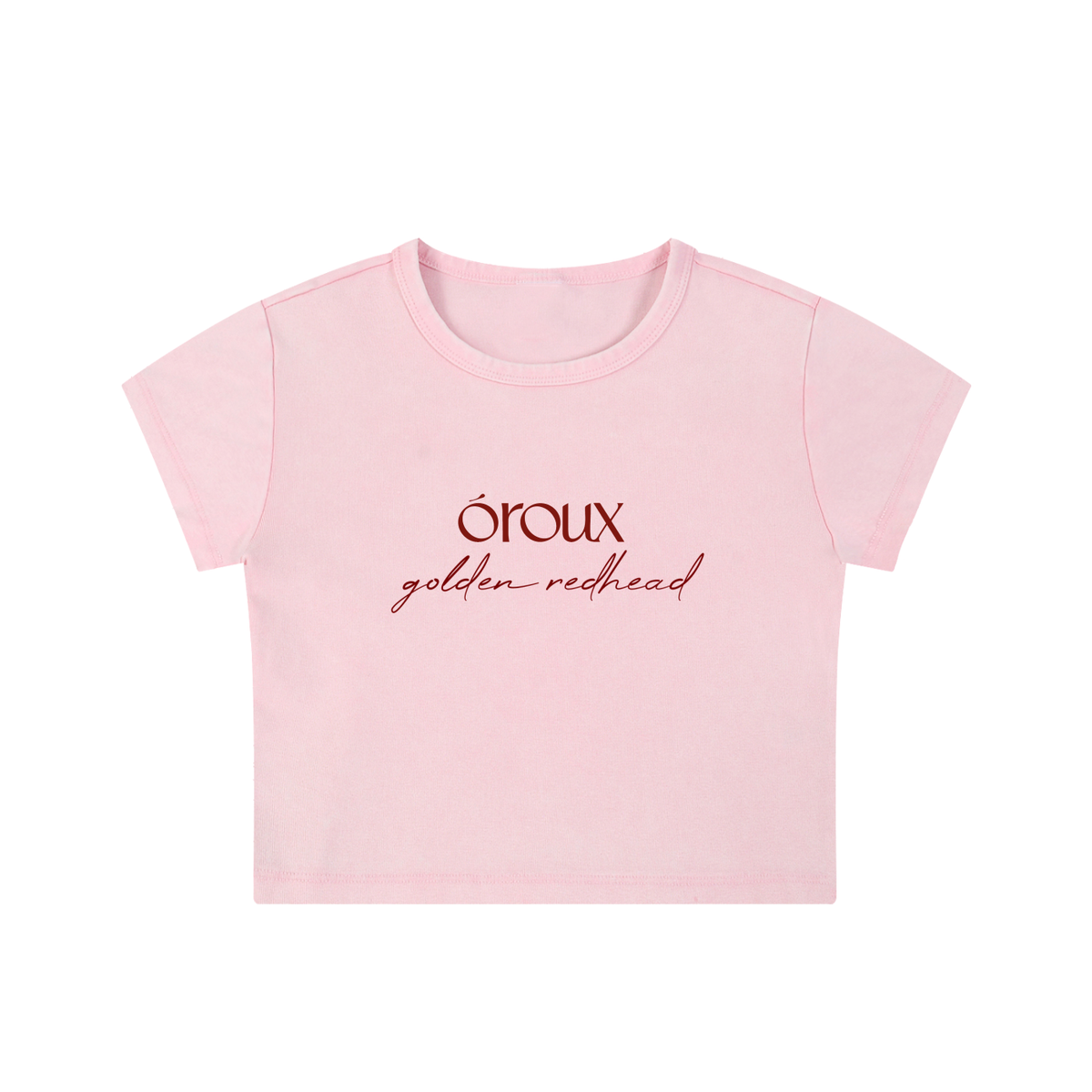 A light pink short-sleeve crop top t-shirt with 'oroux golden redhead' printed in dark red text on the chest, shown against a plain white background.