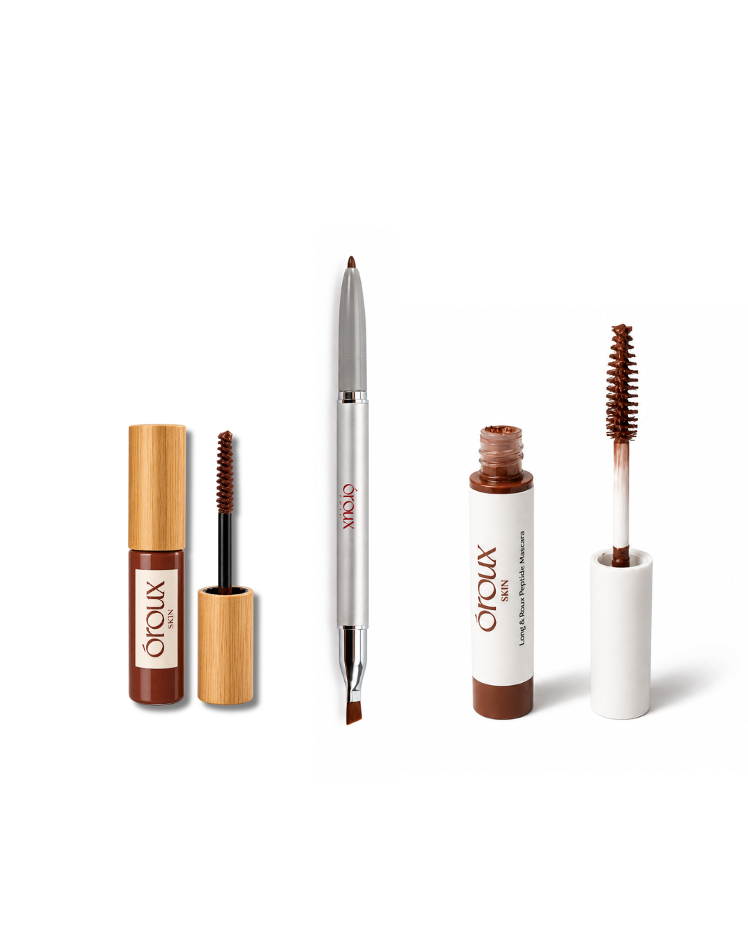 3 oroux cosmetic tools and tubes arranged on a white background: a brown liquid product with a bamboo cap, a silver dual-ended applicator, a brown cream product with a white cap, and a reddish spoolie wand in a white tube.