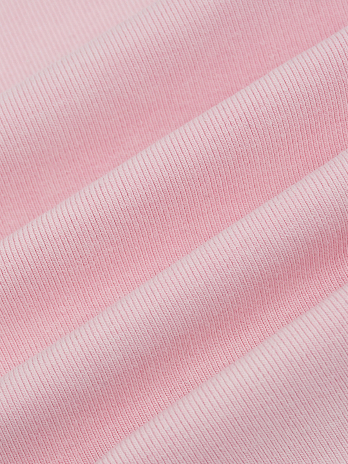 Close-up of pink fabric with a ribbed texture