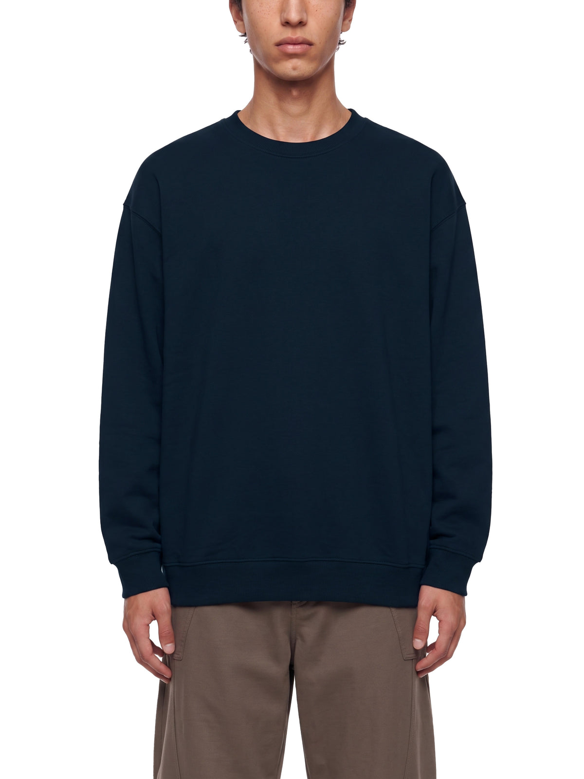 Hang tag and brand label on Badass Redhead oversized crewneck by Óroux Skin