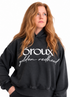 A side-by-side comparison of a model wearing a faded black hoodie with white text that reads &