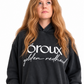 A side-by-side comparison of a model wearing a faded black hoodie with white text that reads 'oroux golden redhead'. The model has long, wavy golden-red hair.