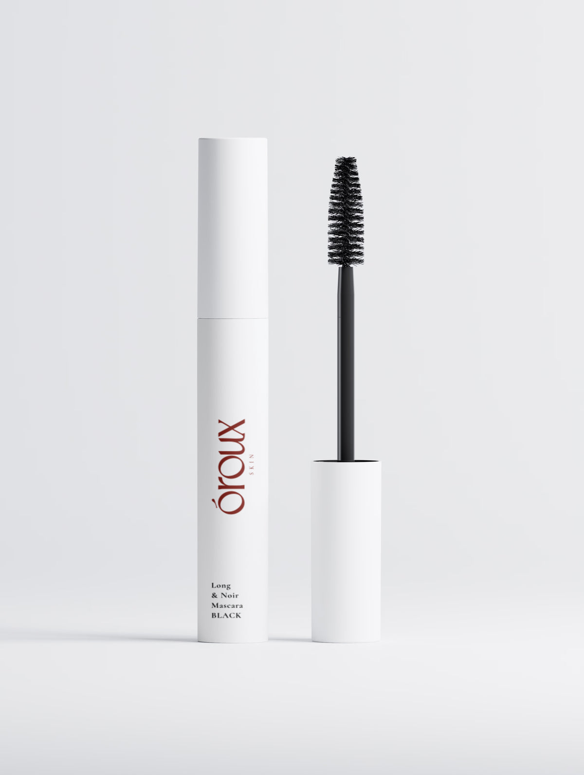 Oroux Totally Tubular Tubing Peptide Mascara in Black, shown with its white cylindrical tube 